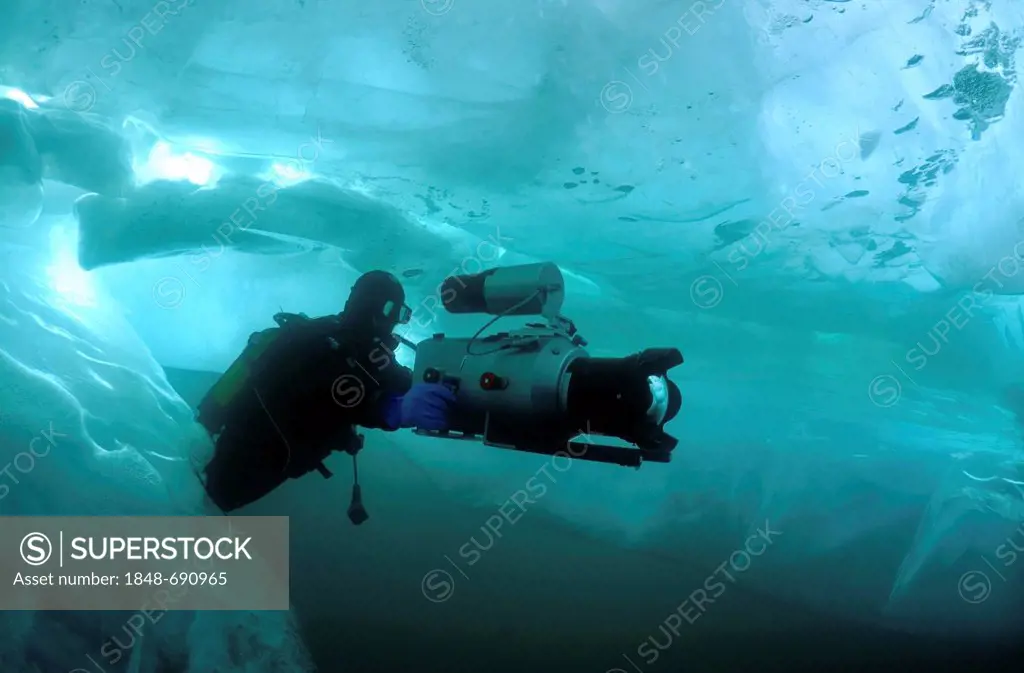 Underwater video-operator Didier Noirot, ice-diving, in Lake Baikal, Olkhon island, Siberia, Russia, Eurasia