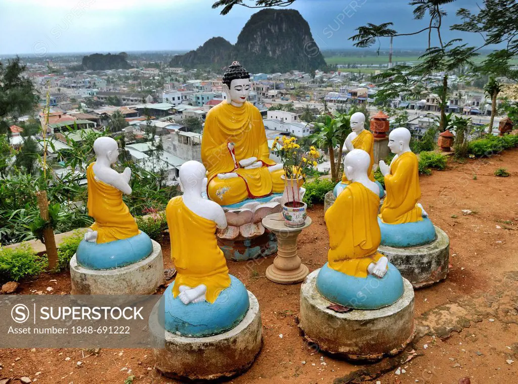 Buddha and praying monks, sculptures in front of Marble Mountains, Ngu Hanh Son, Thuy Son, Da Nang, Vietnam, Asia