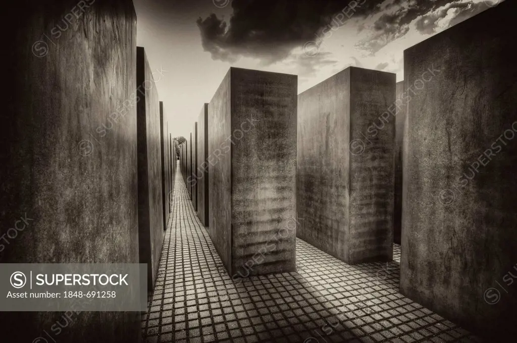 Black and white image, sepia-toned, of the stelae of the Holocaust Memorial designed by architect Peter Eisenman, Memorial to the Murdered Jews of Eur...