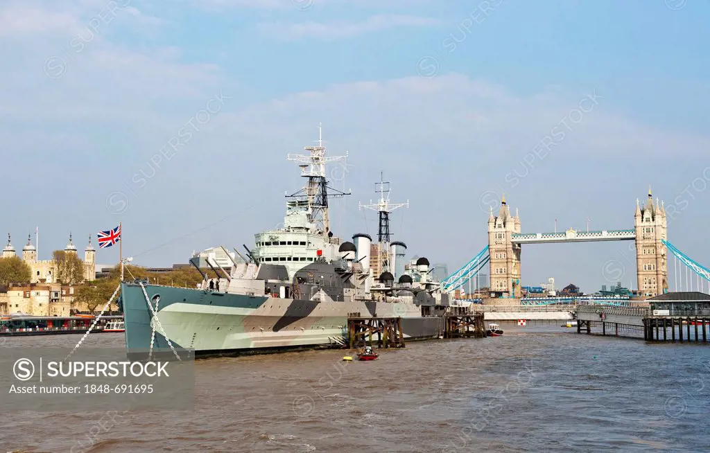 Museum ship HMS Belfast, built 1938, on the River Thames with the Tower of London and Tower Bridge at back, London, England, United Kingdom, Europe