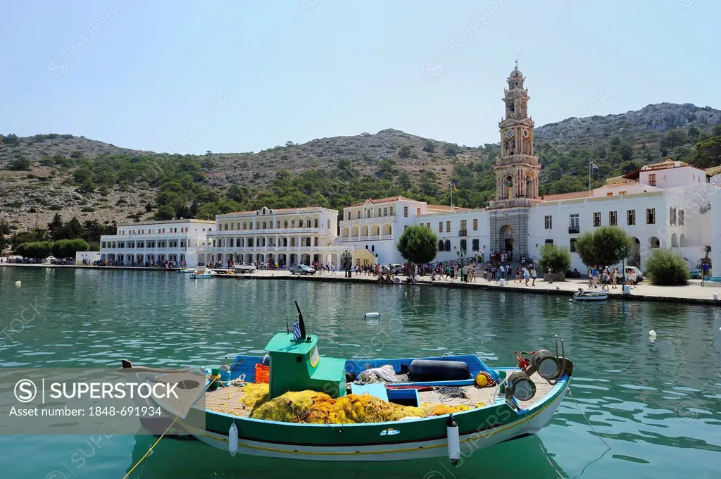 Fishing boat in front of the monastery Taxiarchis Michael Panormitis, Symi island near Rhodes, Greece, Europe