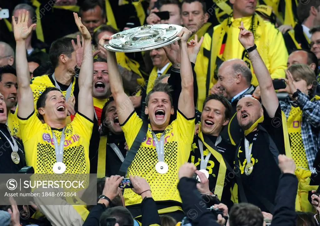 Cheering footballers of BVB Borussia Dortmund with the league cup trophy, after match Borussia Dortmund vs SC Freiburg (4:0), Signal Iduna Park, Dortm...