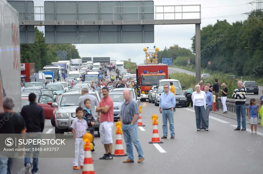 People standing on the Autobahn, motorway, traffic jam following a serious road traffic accident on the Autobahn A81 motorway, Ludwigsburg, Baden-Wuer...