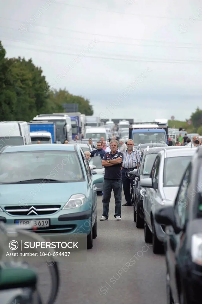 People standing on the Autobahn, motorway, traffic jam following a serious road traffic accident on the Autobahn A81 motorway, Ludwigsburg, Baden-Wuer...