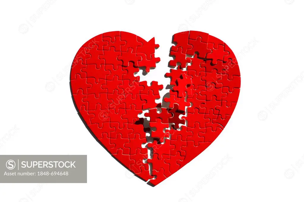 Red heart-shaped jigsaw puzzle, torn in half