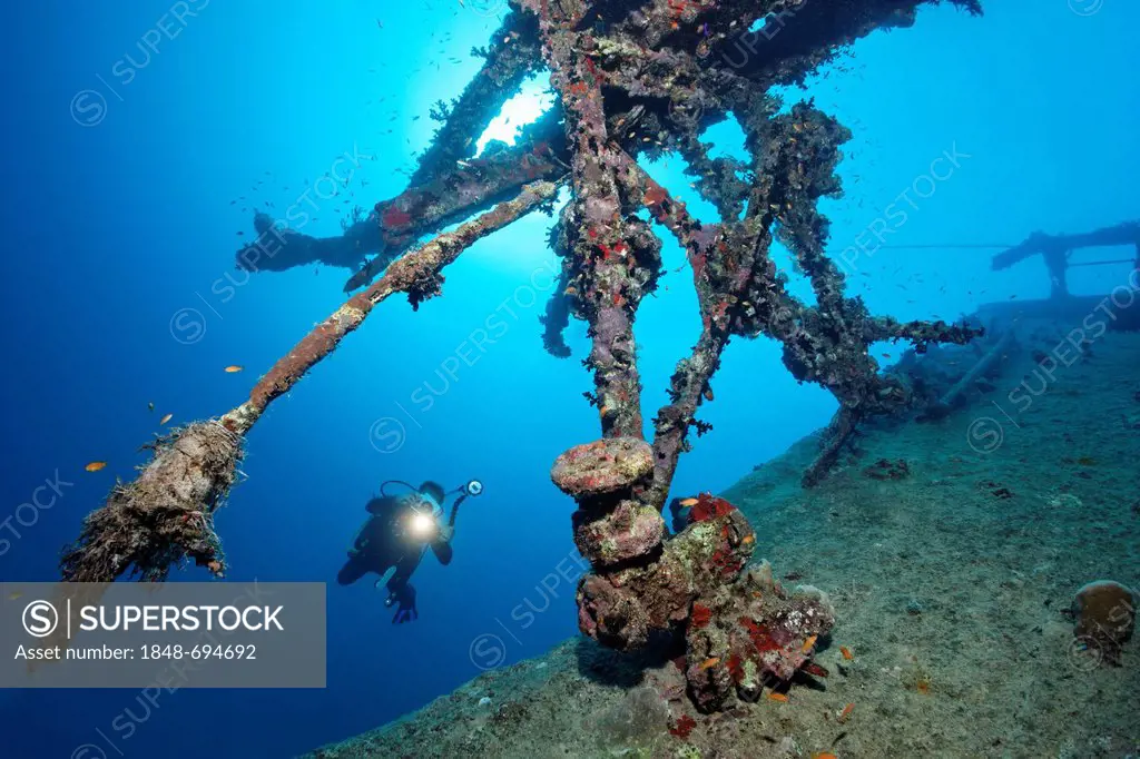 Scuba diver with a video camera, superstructure at shipwreck, tanker, S.S. Turbo, build 1912, sank on 4/4/1942 during World War II, hit by Italian tor...