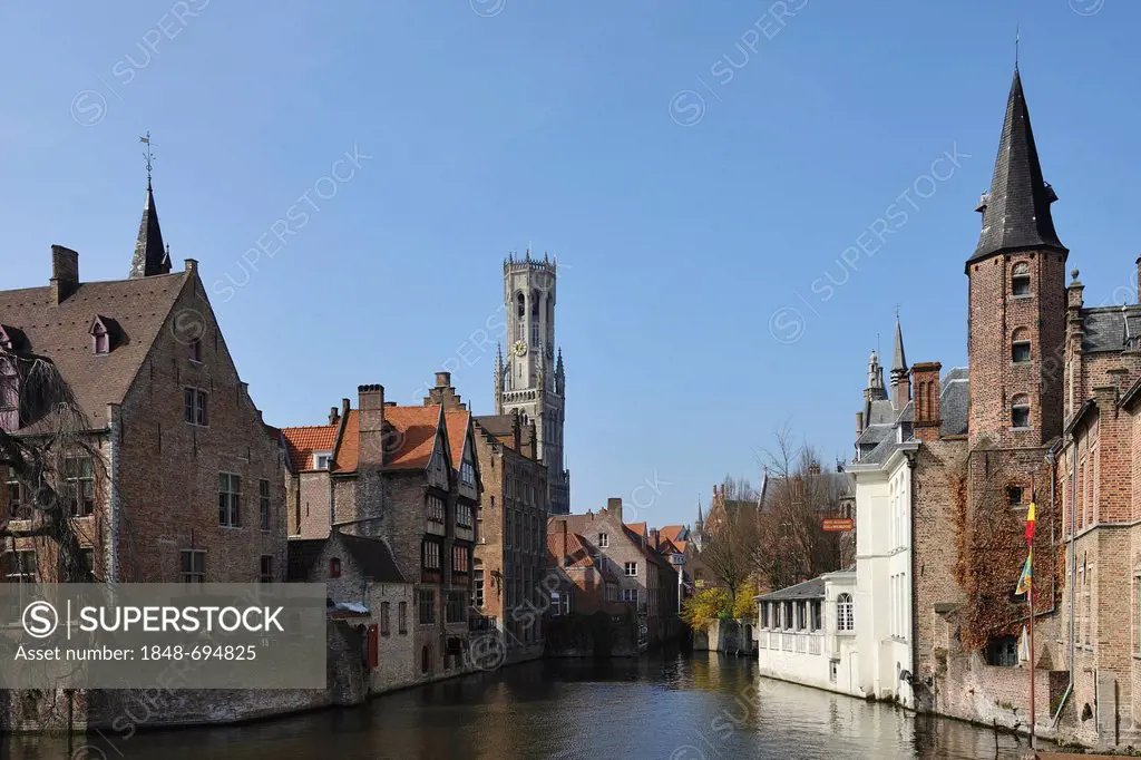 The canals of Bruges, overlooking the Rozenhoedkaai and the belfry at back, Bruges, Flanders, Belgium, Europe