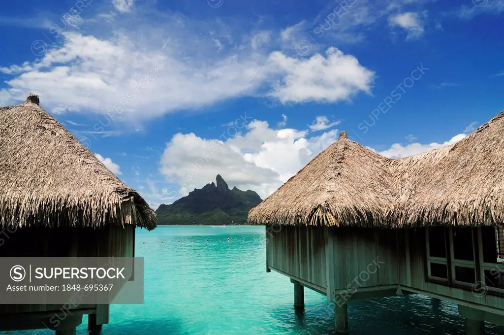 Huts on stilts, overlooking Mt Otemanu, from St. Regis Bora Bora Resort, Bora Bora, Leeward Islands, Society Islands, French Polynesia, Pacific Ocean