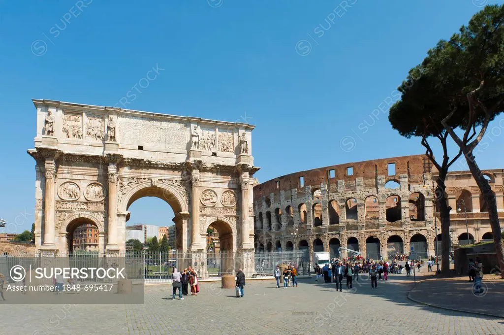 Triumphal arch on Via Triumphalis, Arch of Constantine dedicated to Emperor Constantine, and the Colosseum, Forum Romanum, ancient Rome, Rome, Lazio, ...