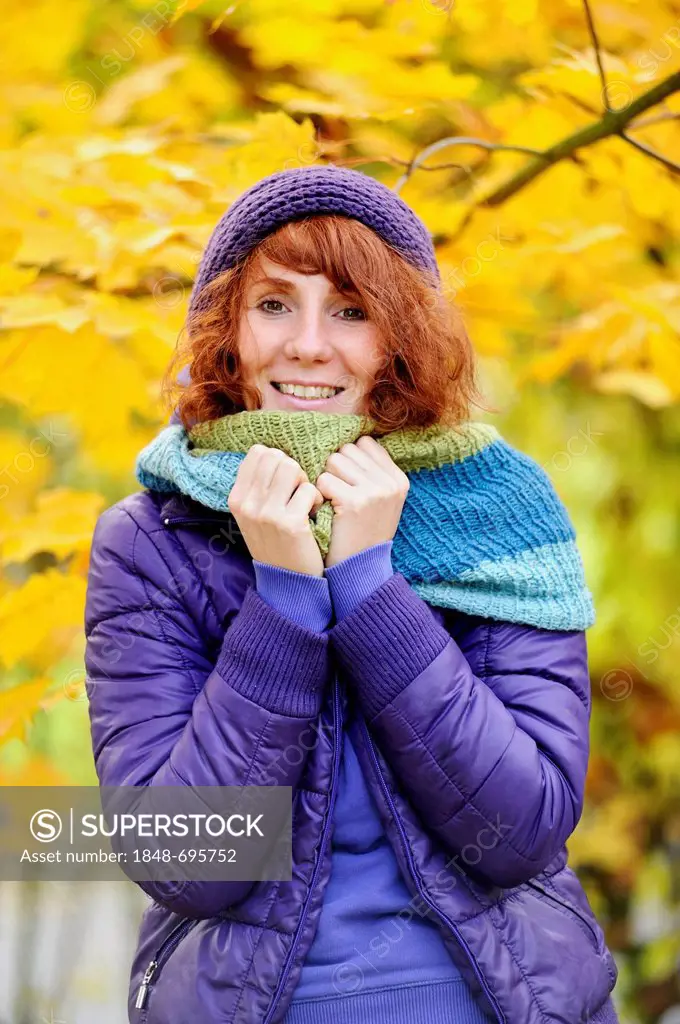 Happy woman in an autumnal environment