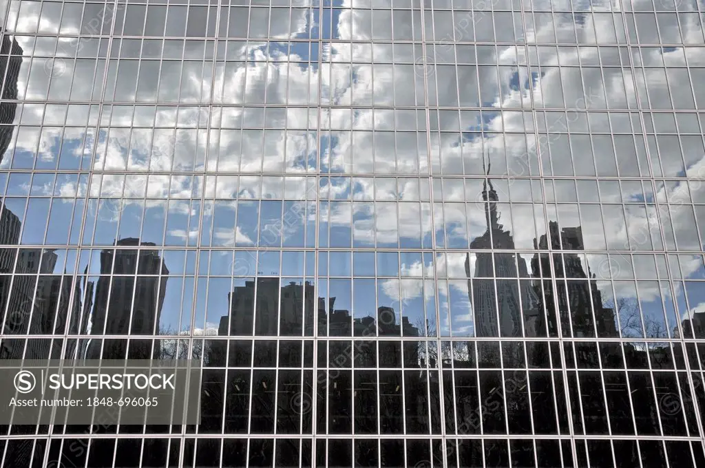 High-rise buildings reflected in glass facade, Financial District, Manhattan, New York City, USA, America, PublicGround