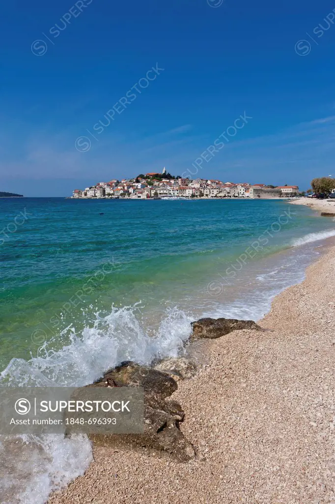 Beach, Primosten peninsula at back, central Dalmatia, Dalmatia, Adriatic coast, Croatia, Europe, PublicGround