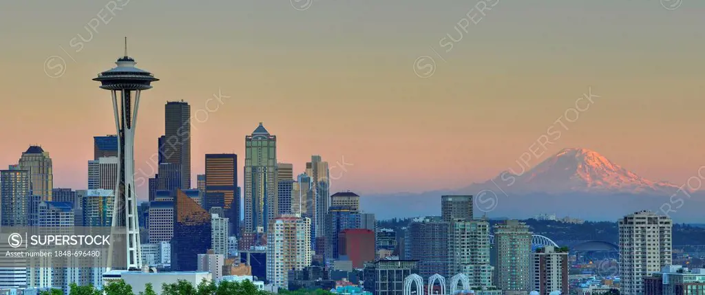 Skyline at dusk, Seattle financial district with Space Needle, Mount Rainier at back, Columbia Center, formerly Bank of America Tower, Washington Mutu...