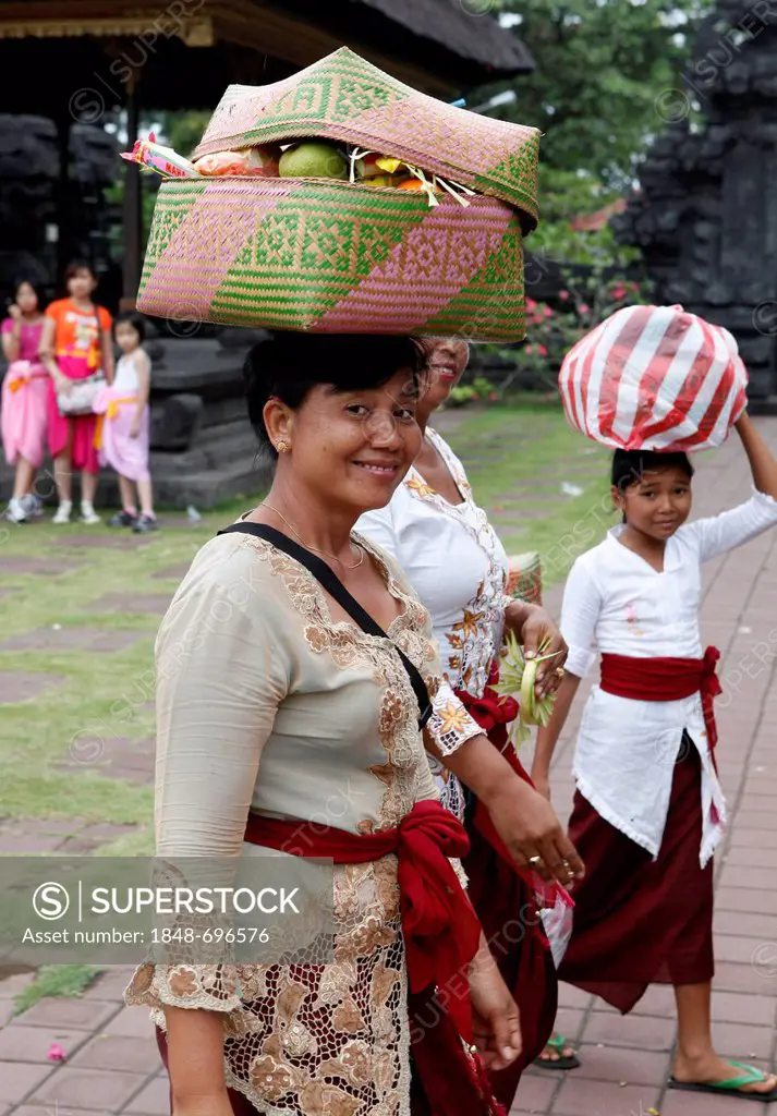 Women with religious offerings, religious ceremony at a temple complex in front of the bat cave, Goa Lawah, Bali, Indonesia, Southeast Asia, Asia