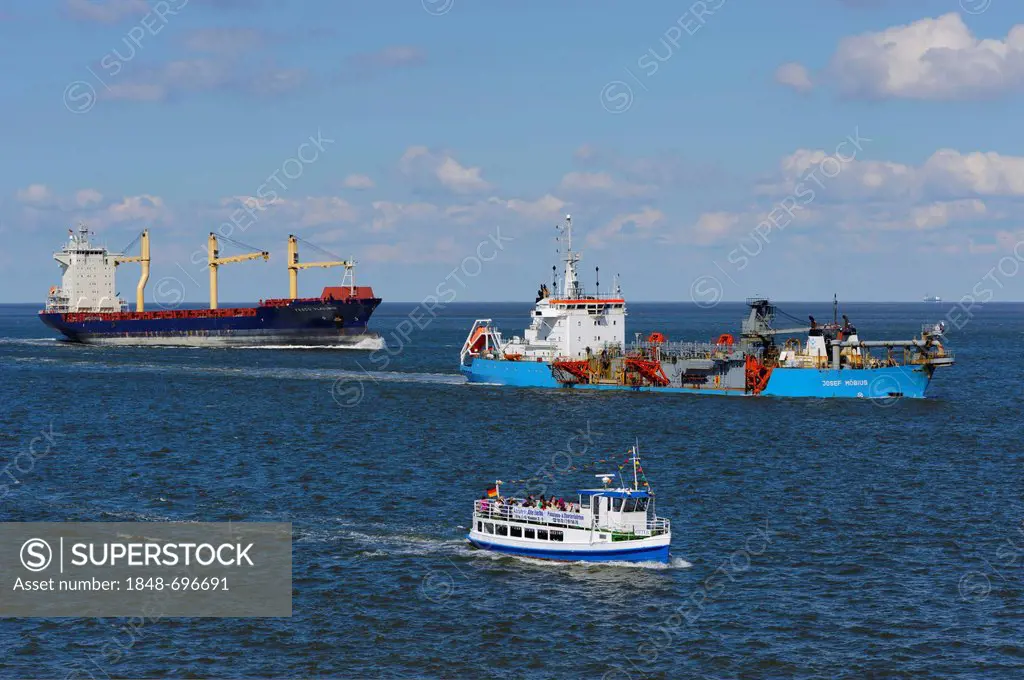 A Container vessel, a suction dredger and a launch passing Cuxhaven, Lower Saxony, Germany, Europe, PublicGround