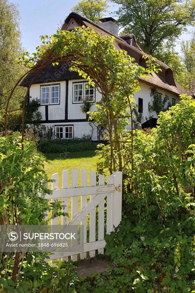 Half-timbered house behind a garden gate, Sieseby on the Schlei river, Thumby, Rendsburg-Eckernfoerde district, Schleswig-Holstein, Germany, Europe