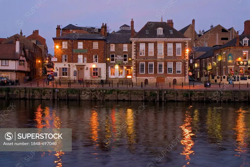 Illuminated facades at the River Ouse at the blue hour, in York, Yorkshire, United Kingdom, Europe