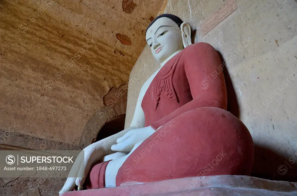 Buddhism, seated Buddha figure in the pagoda of Htilominlo Temple from the 13th Century, one of the last great temples built before the fall of the Ba...