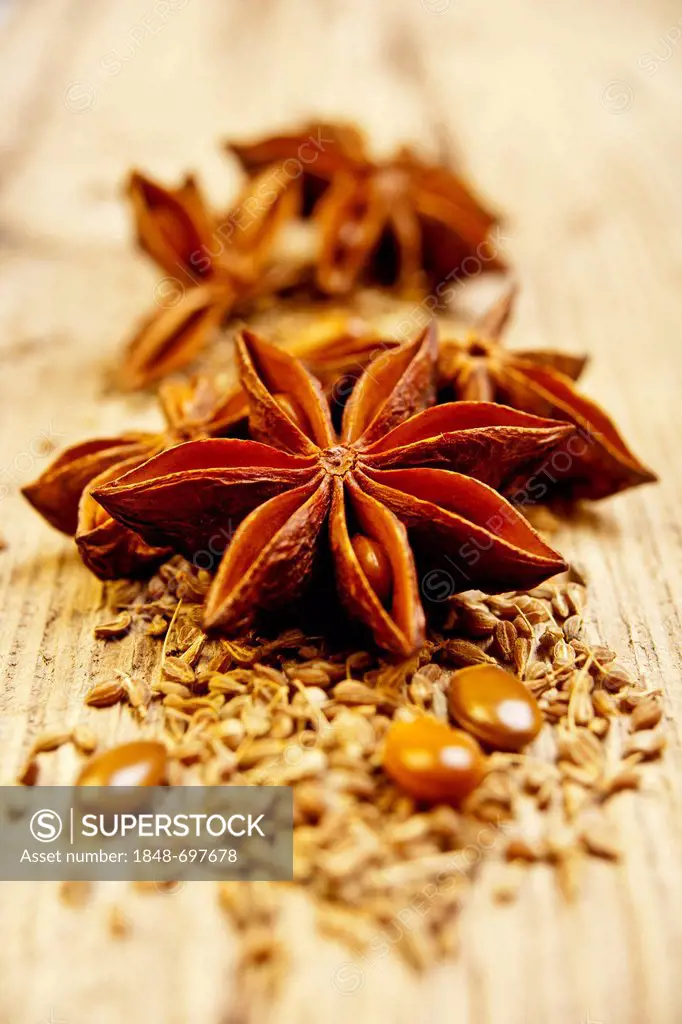 Anise and star anise on a wooden surface