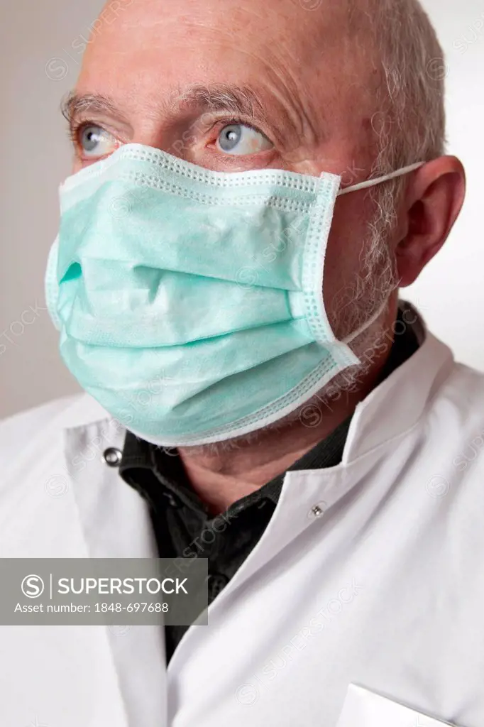 Doctor, physician wearing a white coat and a medical face mask