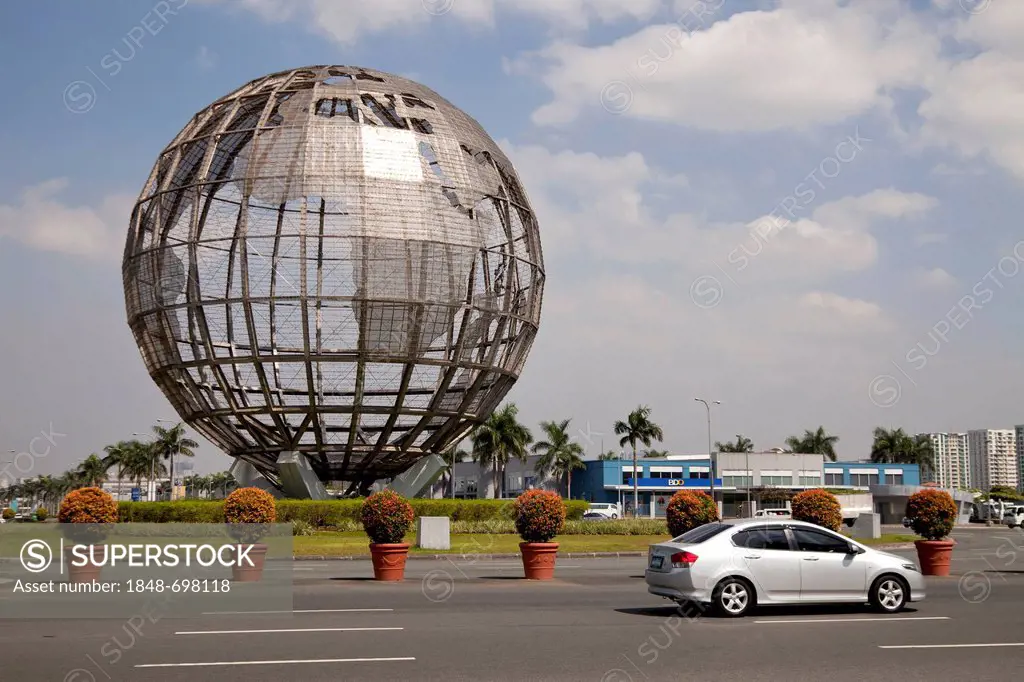 Giant globe at a roundabout outside the Mall of Asia shopping centre, Manila, Philippines, Asia