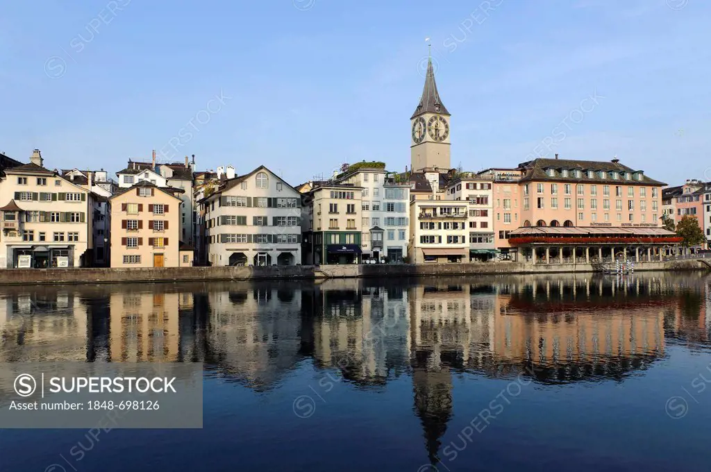 St. Peter's church and a bank of the Limmat river in Zurich, Switzerland, Europe