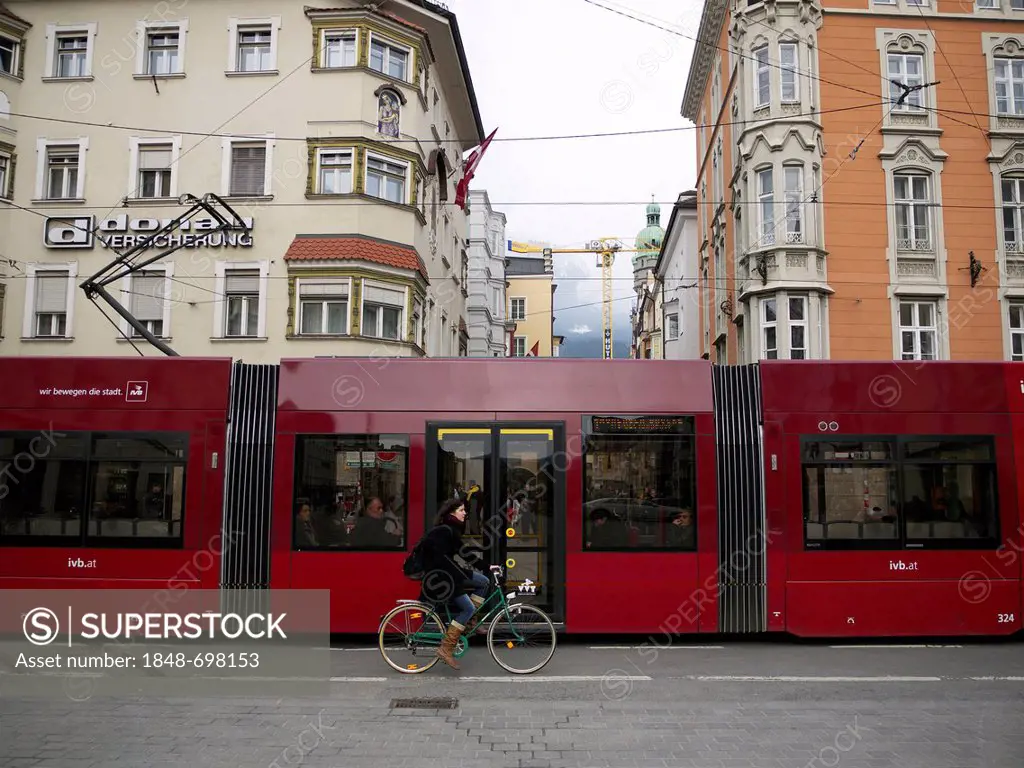 Modern light rail in front of the historic town scenery, Innsbruck, Tyrol, Austria, Europe