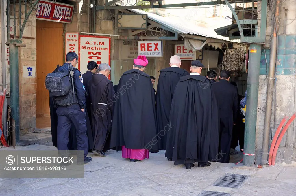 Patriarchy being escorted by soldiers during the sunday procession from the Latin Patriarchate Church through a street with a bazaar to the Church of ...