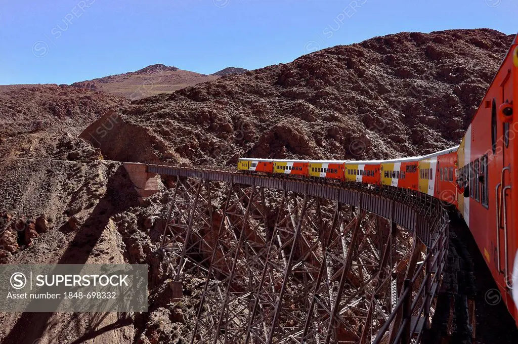 Tourist attraction Tren a las Nubes, Train to the Clouds, on the Polvorillo Viaduct, in the High Andes, near Salta, borderland Argentina - Bolivia, So...