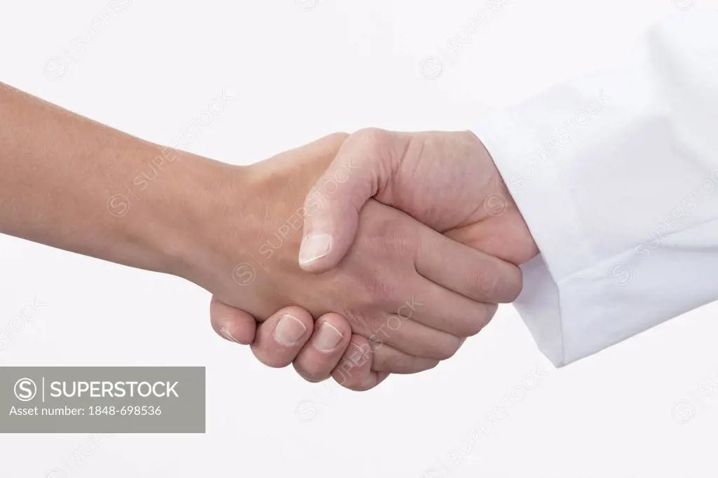 Hands shaking, handshake between patient and doctor