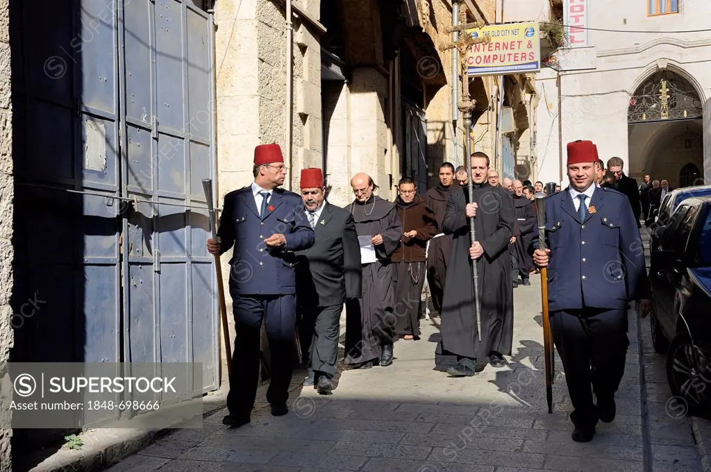 Patriarch of the Latin Patriarchate of Jerusalem being escorted by a guard of honour during the sunday procession from the Latin Patriarchate Church t...