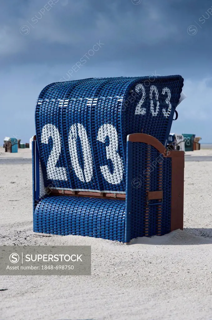 Beach chair on Neuharlingersiel North Sea beach, East Frisia, Lower Saxony, Germany, Europe