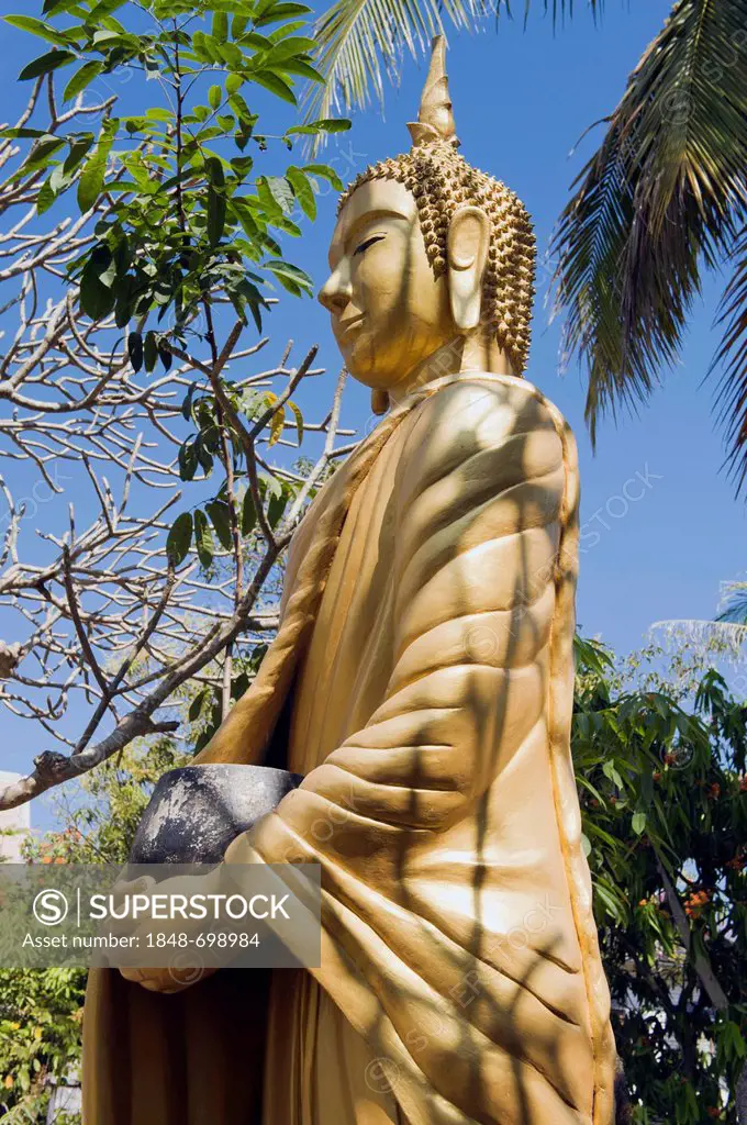 Buddha statue holding a begging bowl, Luang Prabang, UNESCO World Heritage Site, Laos, Indochina, Asia