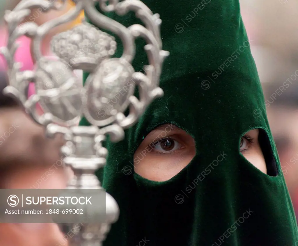 Female hooded penitent at the Semana Santa procession, Holy Week, Barcelona, Catalonia, Spain, Europe