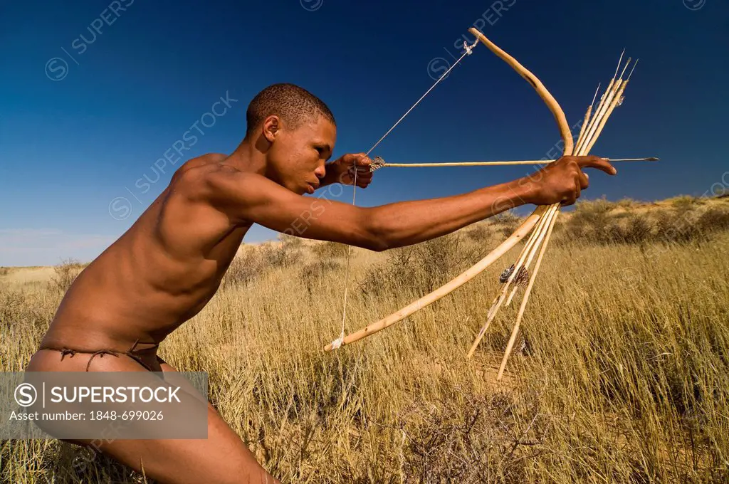 San, Bushman, with a bow and arrow, near Andriesvale, Kalahari Desert, Northern Cape, South Africa, Africa