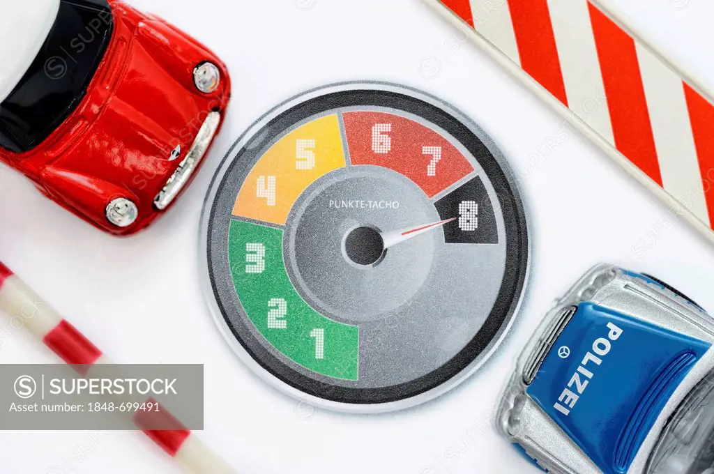 Miniature cars, police car, speedometer with points, symbolic image for the new penalty point system for traffic offenders in Germany