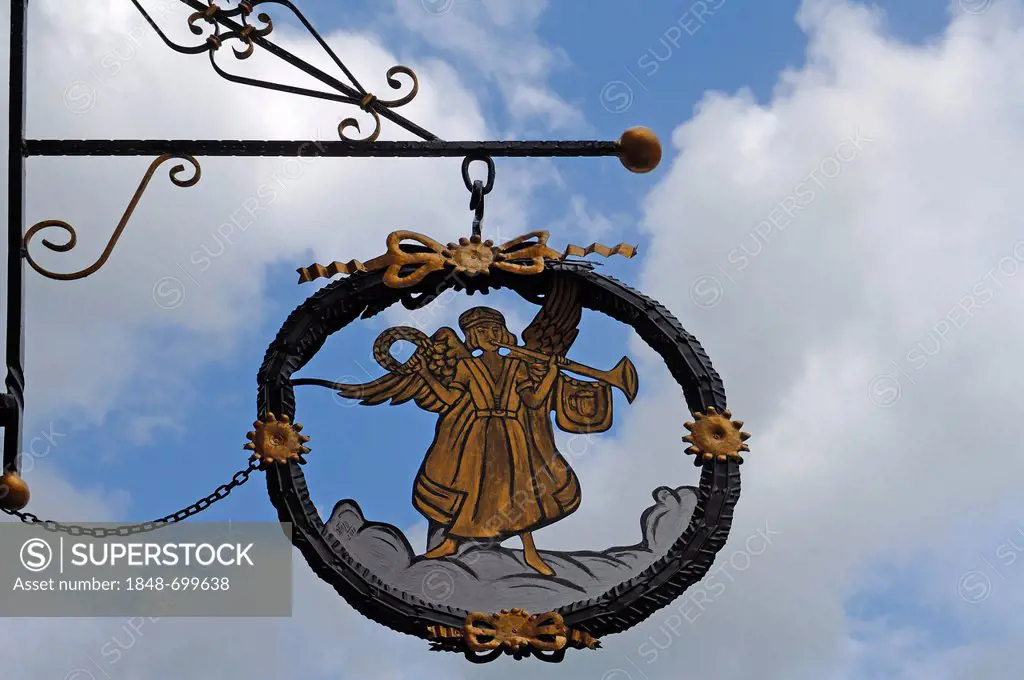 Hanging sign of Engel restaurant against a cloudy sky, Hauptstrasse 5, Gengenbach, Baden-Wuerttemberg, Germany, Europe