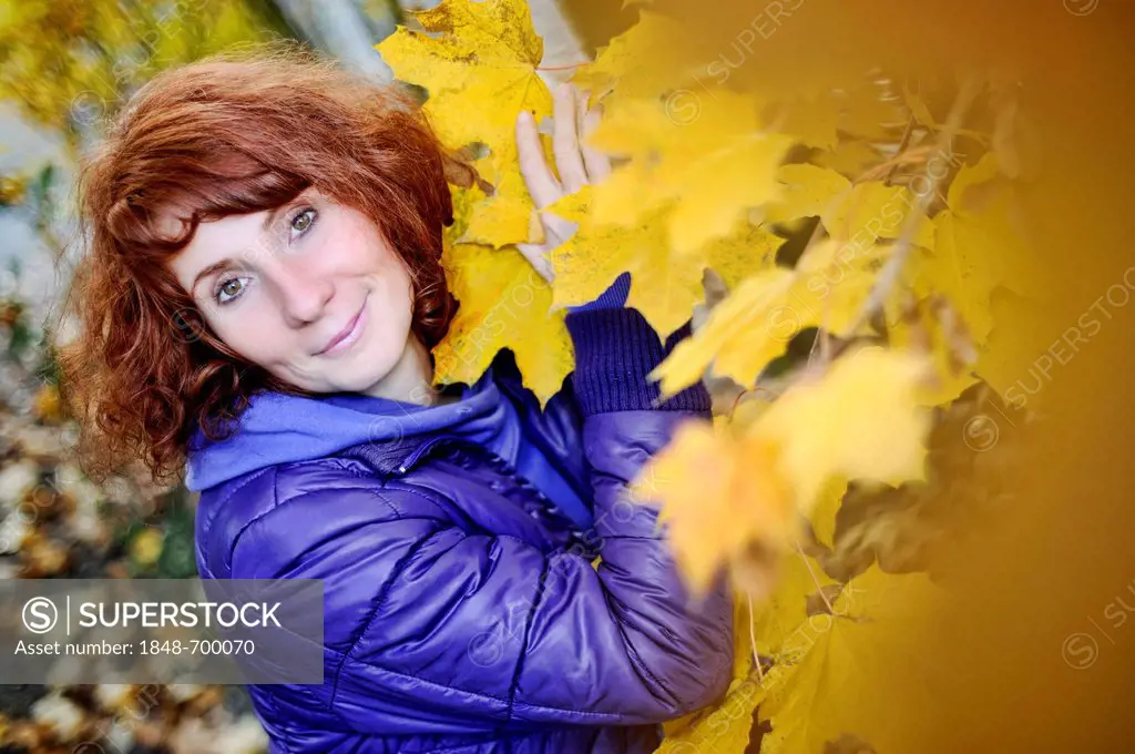 Happy woman in an autumnal environment
