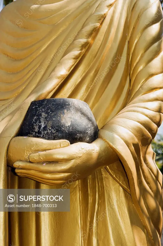 Buddha statue holding a begging bowl, Luang Prabang, UNESCO World Heritage Site, Laos, Indochina, Asia