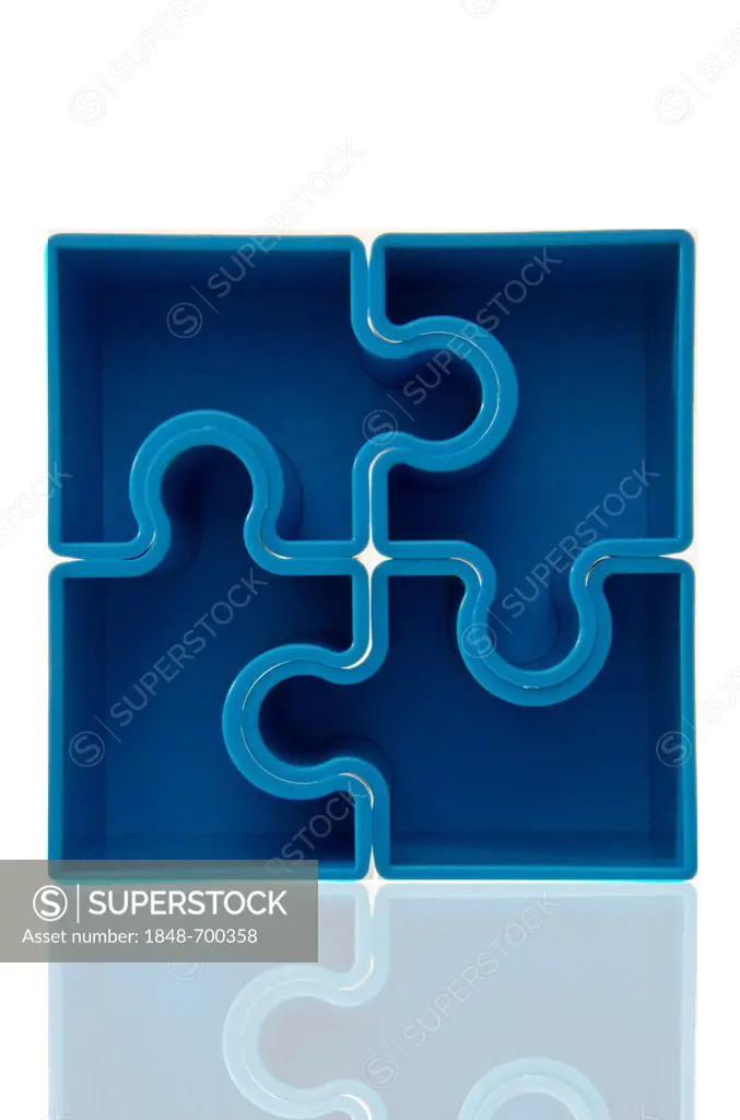 Four blue puzzle pieces forming a square