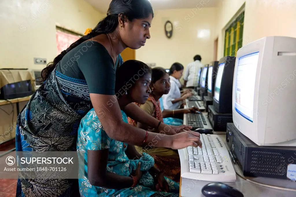 Teacher and Indian girls who are getting computer lessons, Kutti Rajiyam, Kids' World, center for children, Karur, Tamil Nadu, South India, Asia