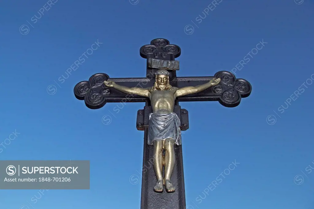 Crucifix against a blue sky