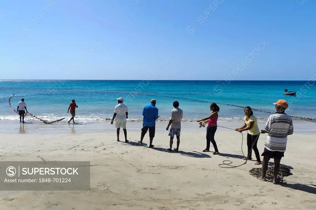 Fishermen with fishing net on the beach of Sao Pedro, Sao Vicente, Cape Verde, Africa