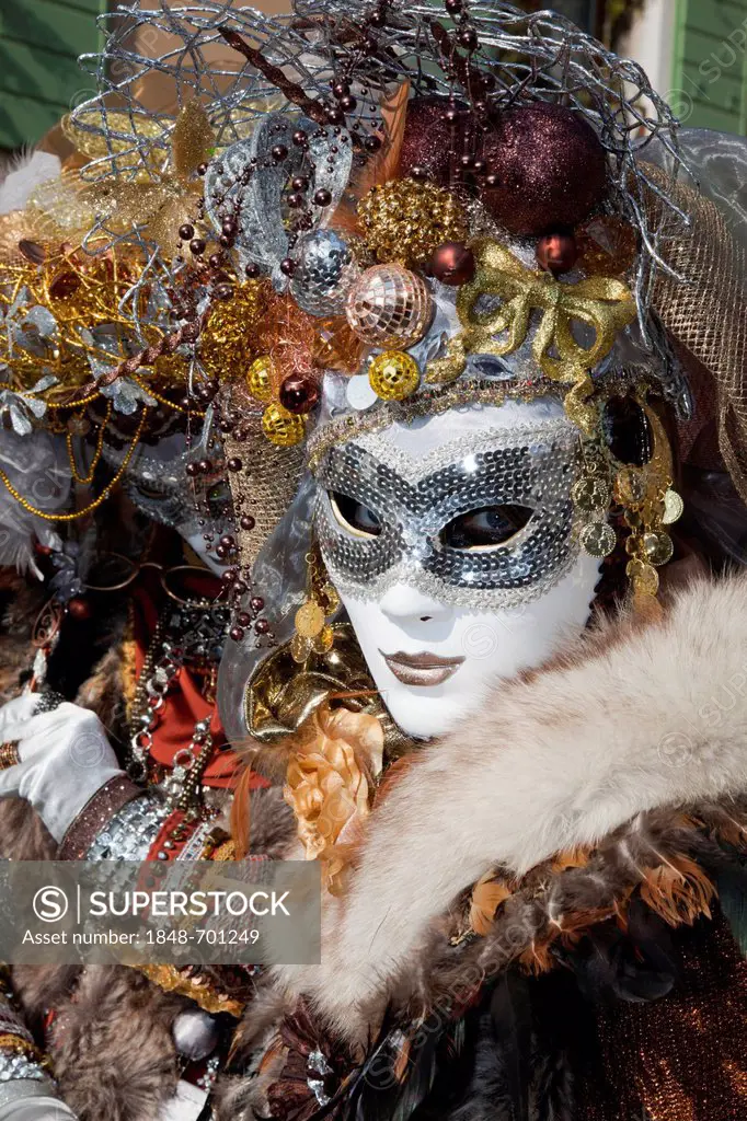 Masked woman with Christmas decorations on her head at the carnival in Venice, Veneto, Italy, Europe