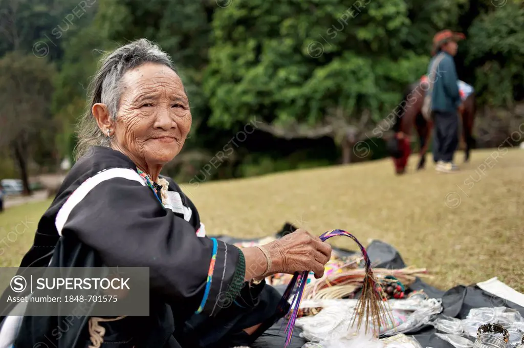 Senior hill tribe woman selling souvenirs at a royal project in north Thailand, Asia