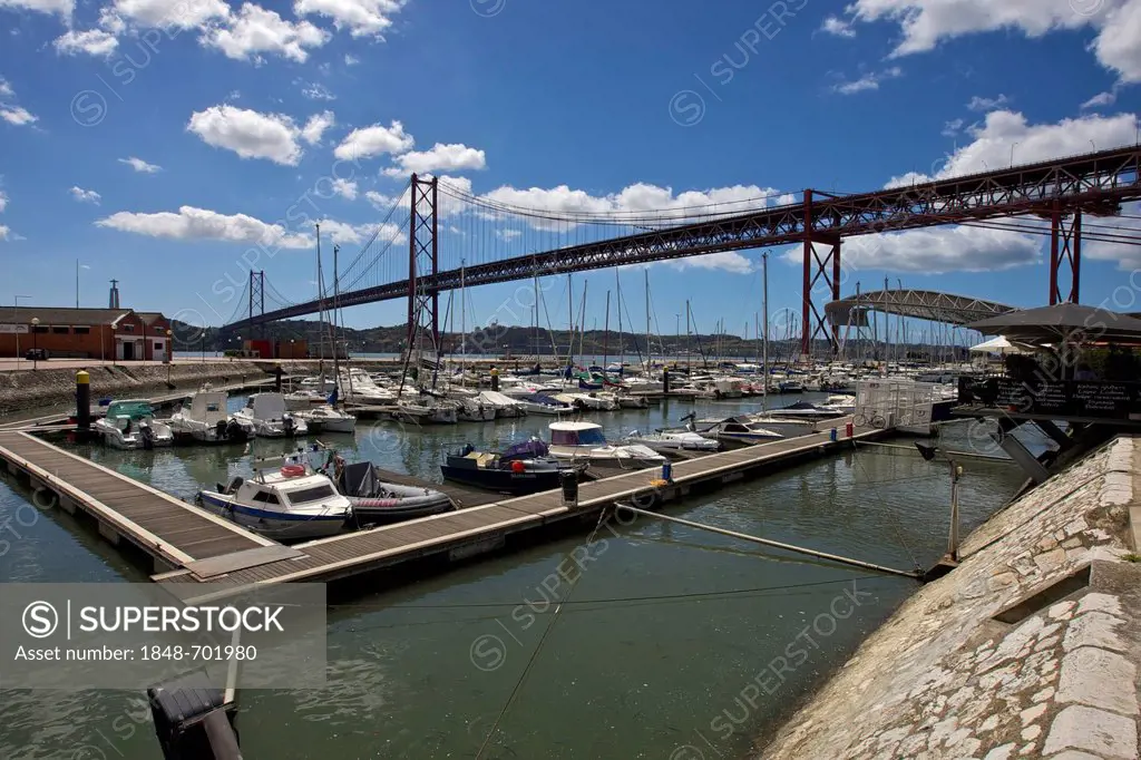 Doca de Santo Amaro, marina on the Tagus river, sun-roof sculpture and Ponte 25 de Abril, suspension bridge, at back, Alcantara, Lisbon, Portugal, Eur...