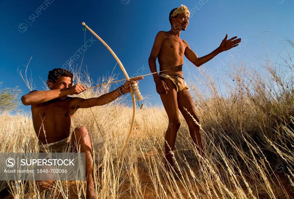 San, Bushmen, with a bow and arrow, near Andriesvale, Kalahari Desert, Northern Cape, South Africa, Africa