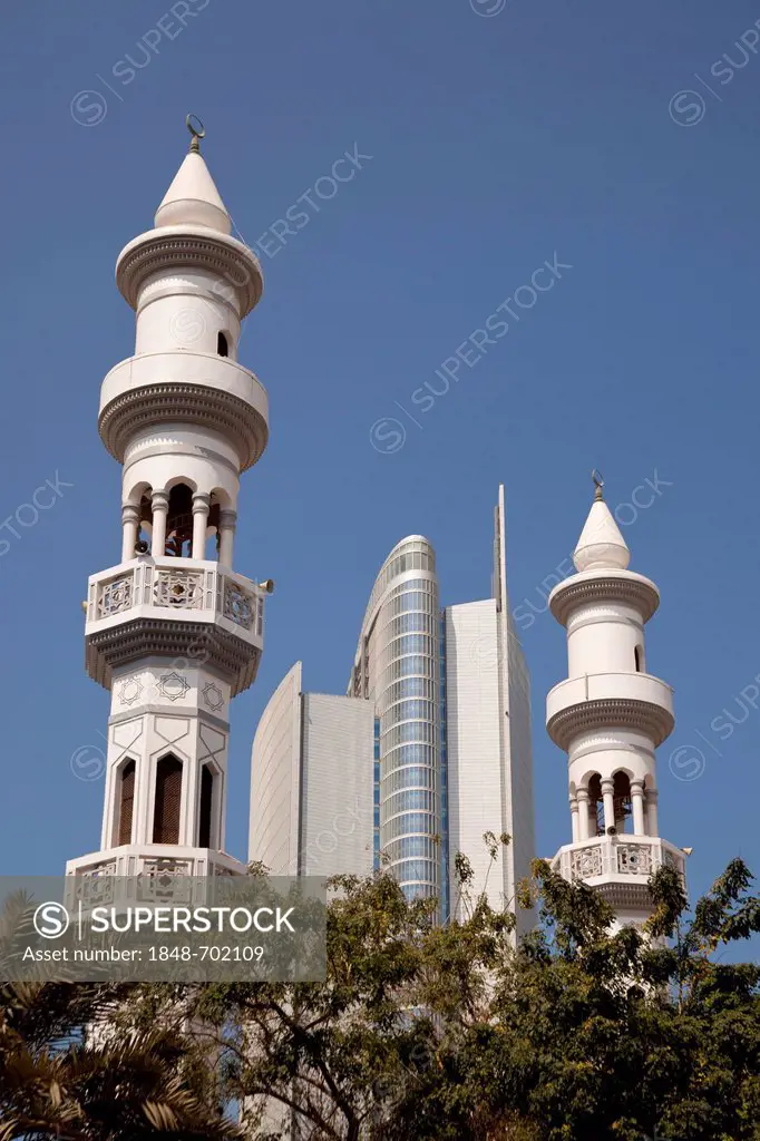 Minarets and modern high-rise buildings in Abu Dhabi, United Arab Emirates, Asia