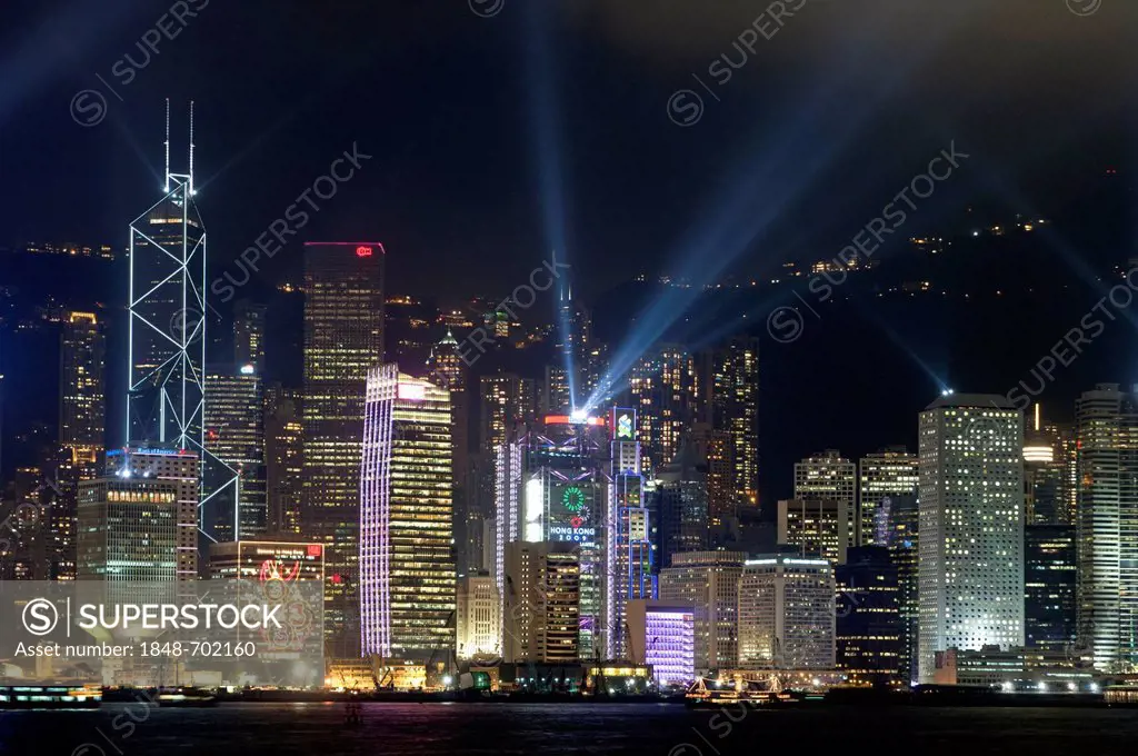 Laser light show on the skyscrapers of the Central District of Hong Kong Island as seen from Kowloon, Hong Kong, China, Asia