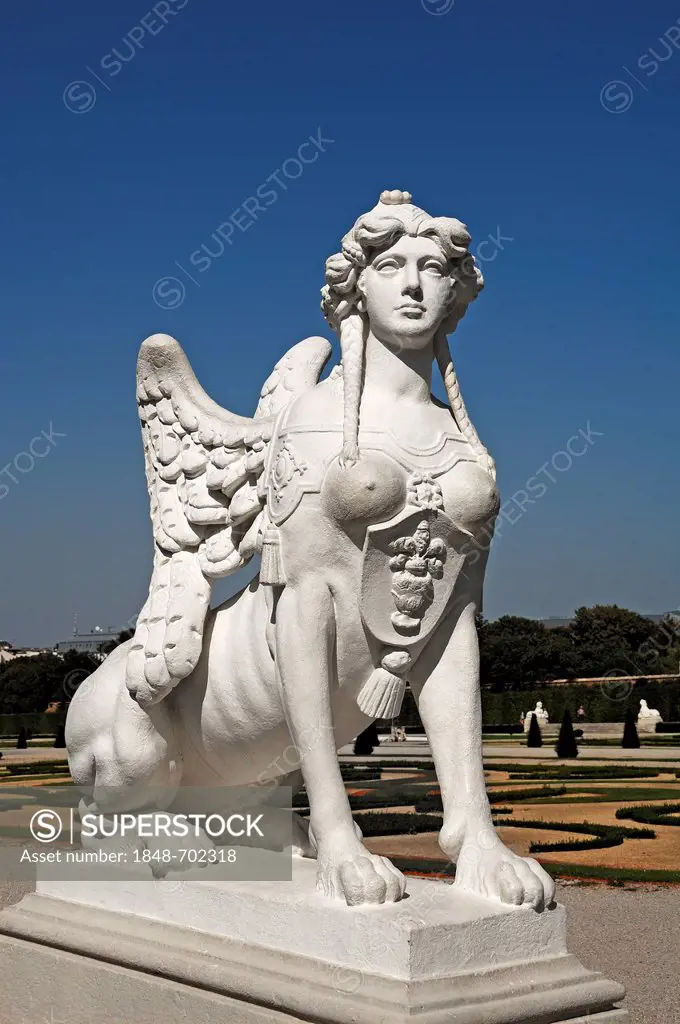 Sculpture of a sphinx against a blue sky at the Oberes Schloss Belvedere palace, Unteres Schloss Belvedere palace at the back, Prinz-Eugen-Strasse str...
